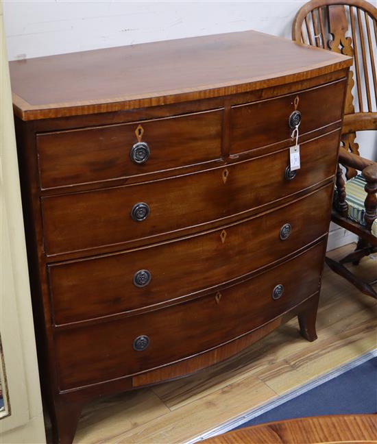 A Regency satinwood banded mahogany bow front chest of two short and three long drawers W.104cm